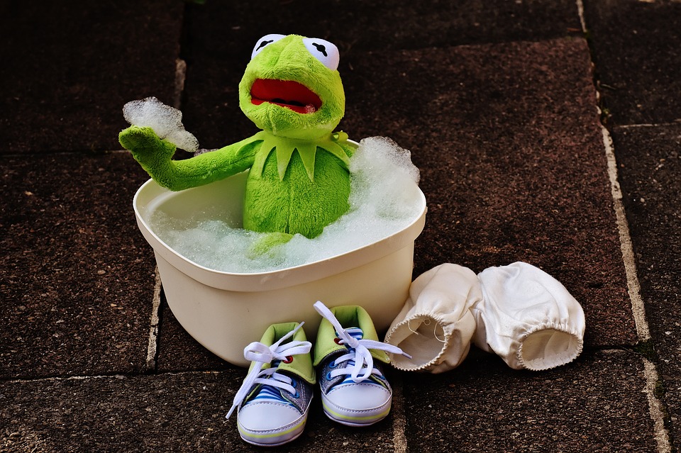 Kermit the frog taking a bath