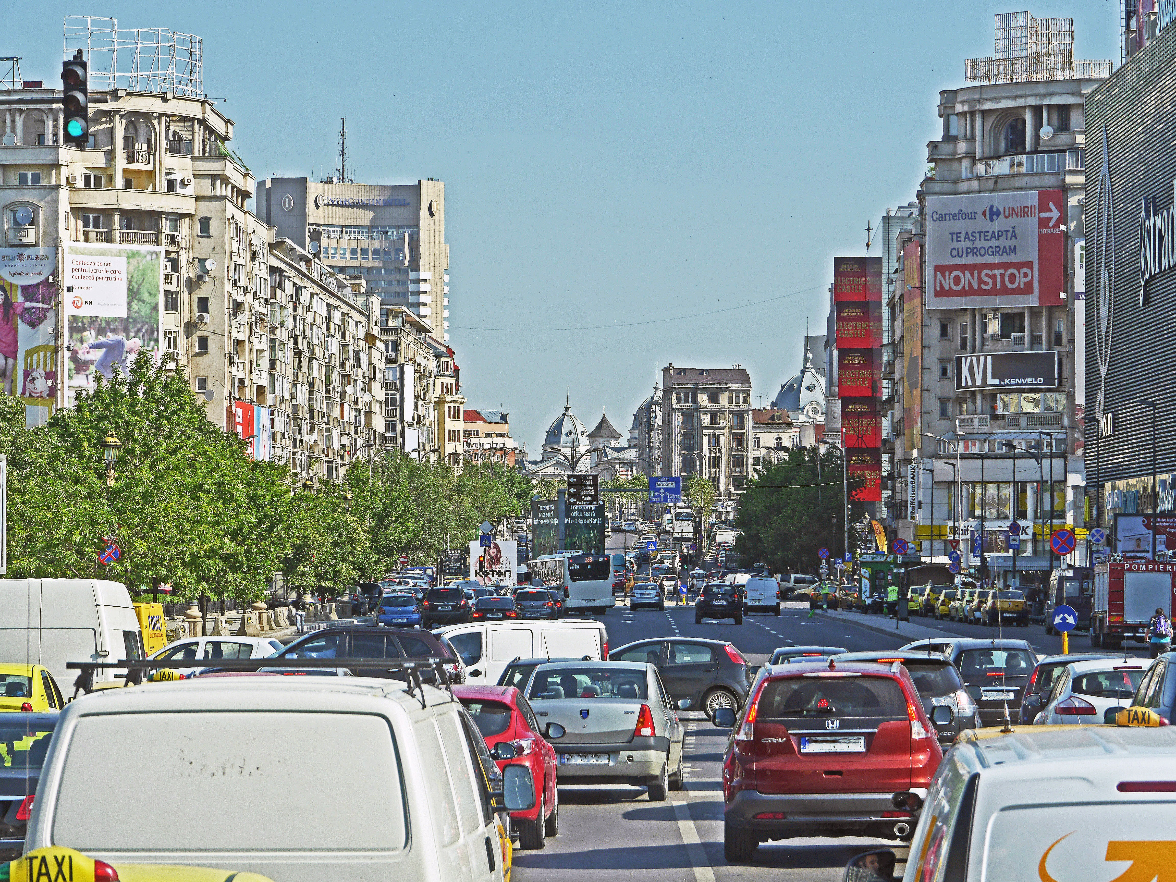 Busy street, buildings and cars in Bucharest